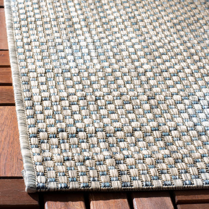 Tapis de patio/jardin imperméable SAFAVIEH Courtyard Begajeta pour intérieur/extérieur.