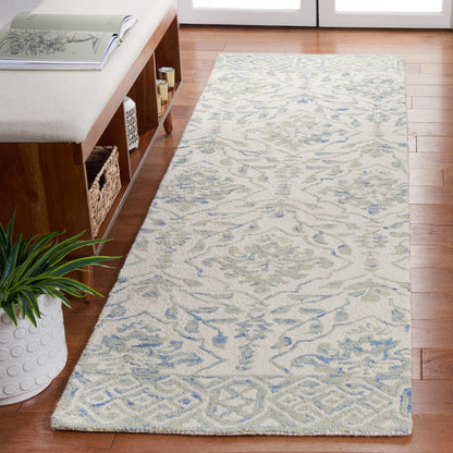 Tapis en laine Elvedina à motif floral, teint à la main par SAFAVIEH