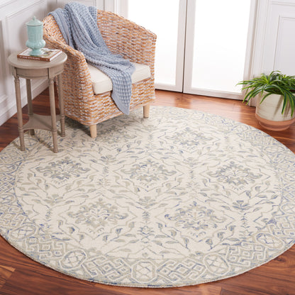 Tapis en laine Elvedina à motif floral, teint à la main par SAFAVIEH