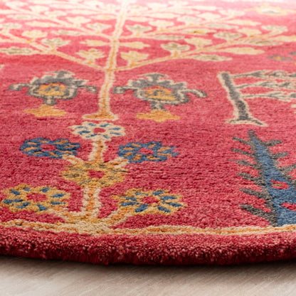 Tapis oriental traditionnel en laine SAFAVIEH fait main, motif floral, style classique.