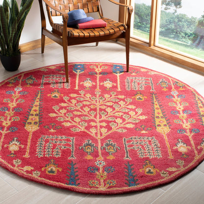 Tapis oriental traditionnel en laine SAFAVIEH fait main, motif floral, style classique.