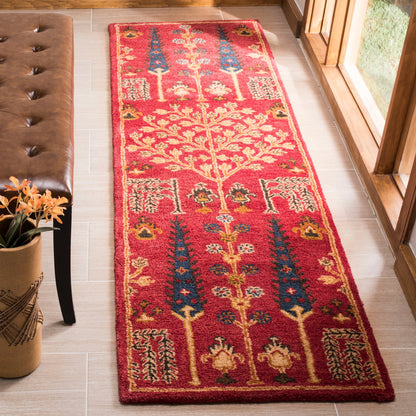 Tapis oriental traditionnel en laine SAFAVIEH fait main, motif floral, style classique.