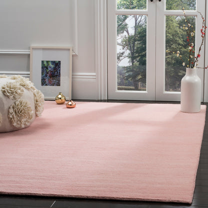 Tapis moderne en laine SAFAVIEH fait main, bordure en palmier de l'Himalaya