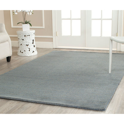Tapis moderne en laine SAFAVIEH fait main, bordure en palmier de l'Himalaya