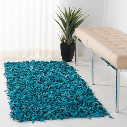 Tapis décoratif moderne SAFAVIEH en cuir shaggy fait main Doinita
