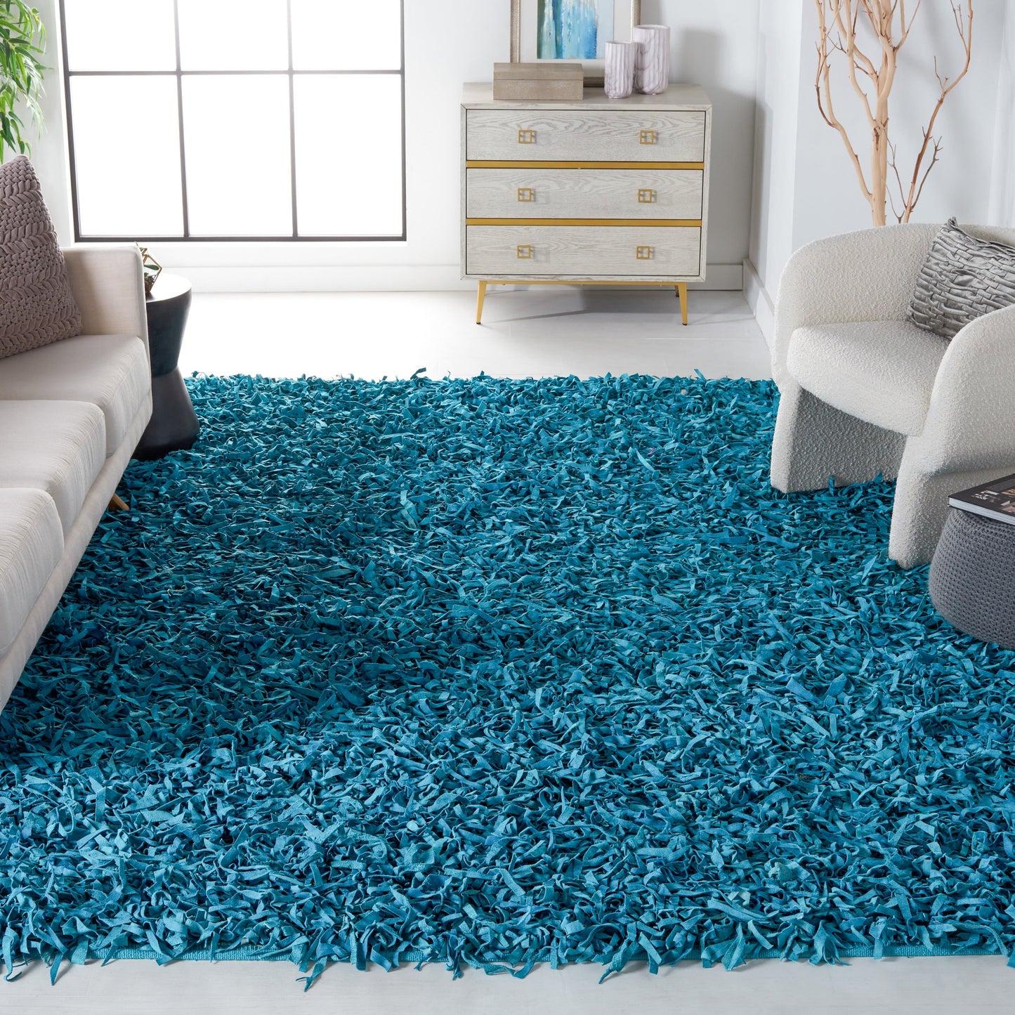 Tapis décoratif moderne SAFAVIEH en cuir shaggy fait main Doinita