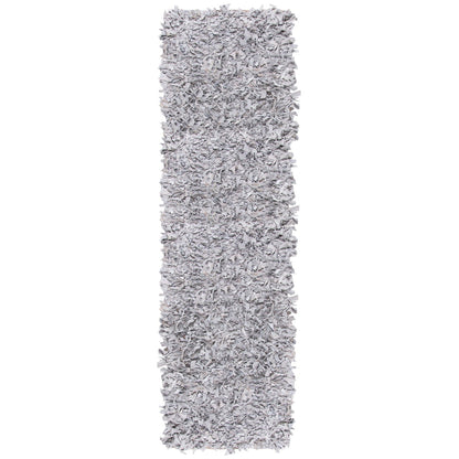 Tapis décoratif moderne SAFAVIEH en cuir shaggy fait main Doinita