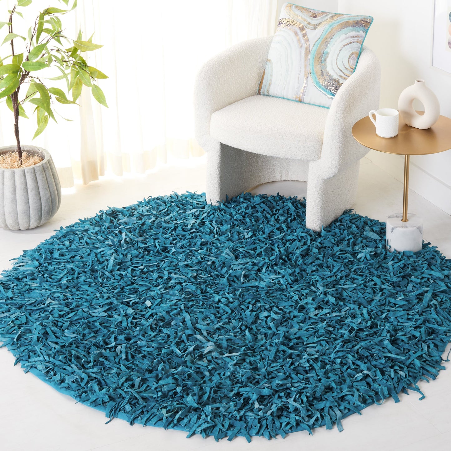 Tapis décoratif moderne SAFAVIEH en cuir shaggy fait main Doinita