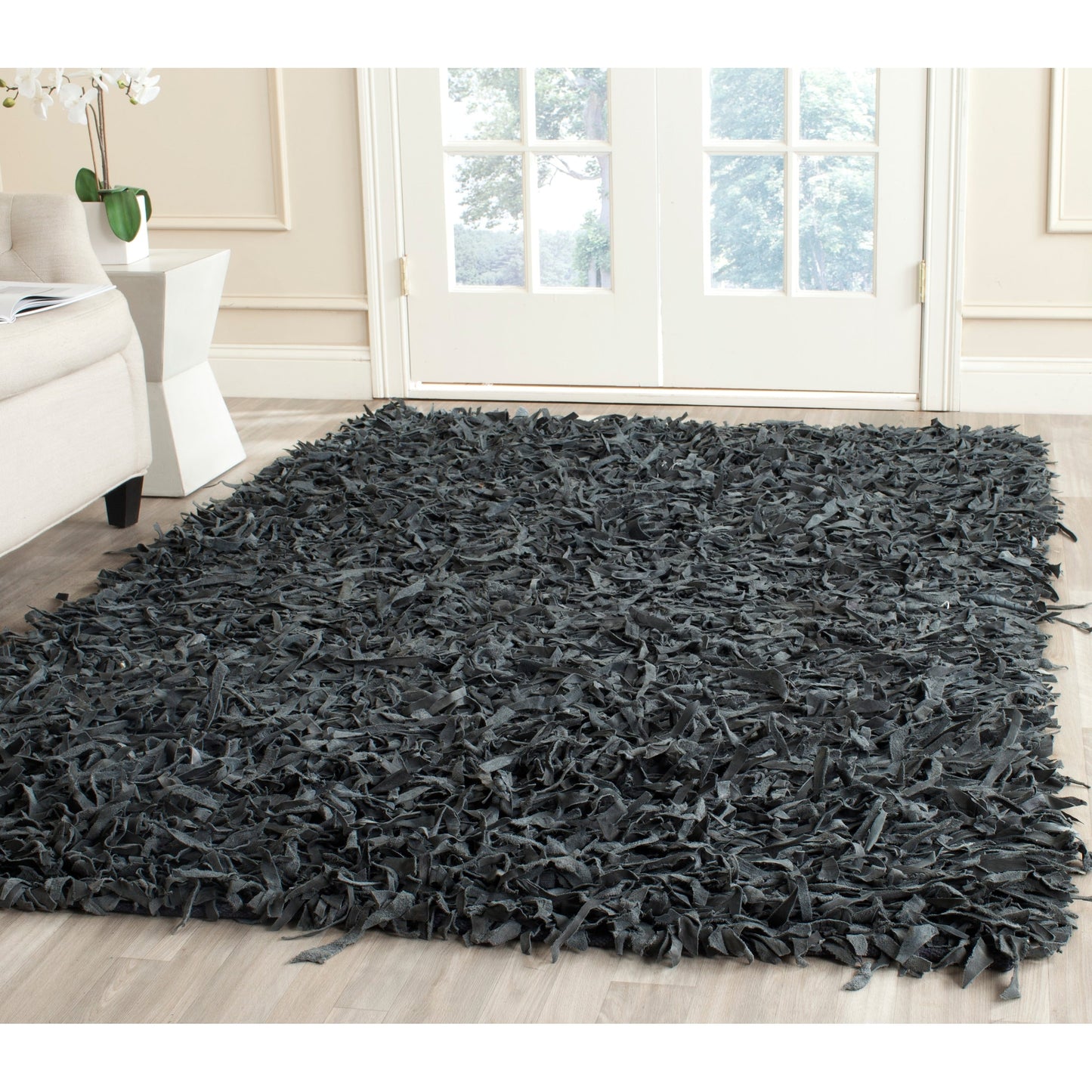 Tapis décoratif moderne SAFAVIEH en cuir shaggy fait main Doinita
