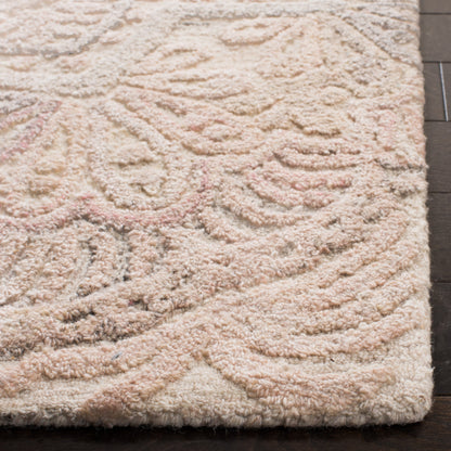 SAFAVIEH Tapis en laine à médaillon moderne Carlijn fait à la main