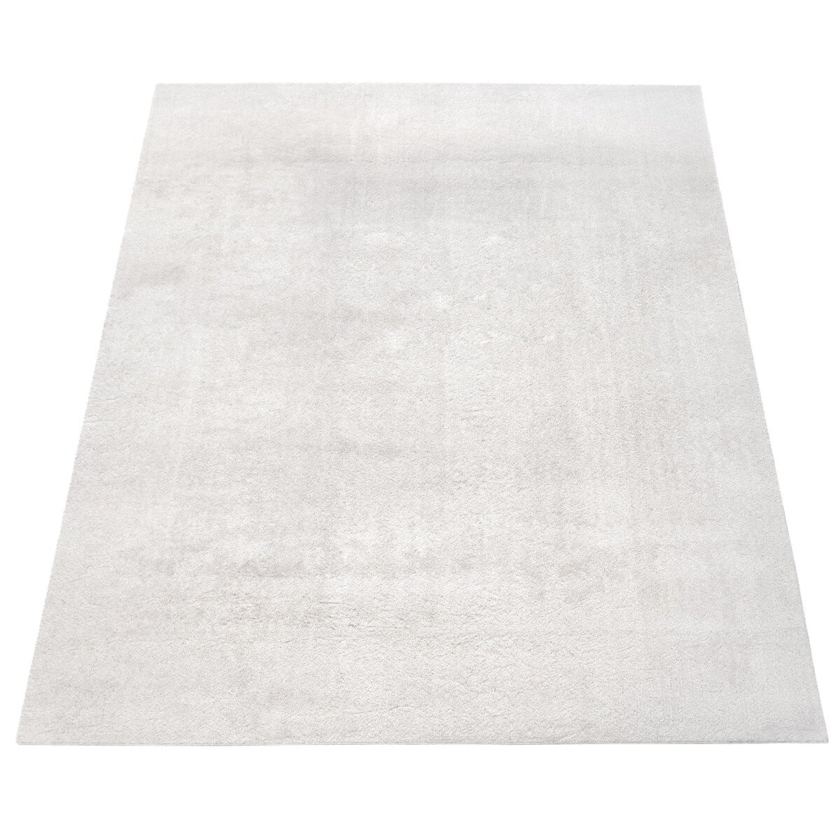 Tapis doux et lavable avec envers antidérapant, disponible en couleurs unies.