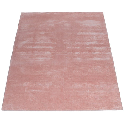 Tapis doux et lavable avec envers antidérapant, disponible en couleurs unies.